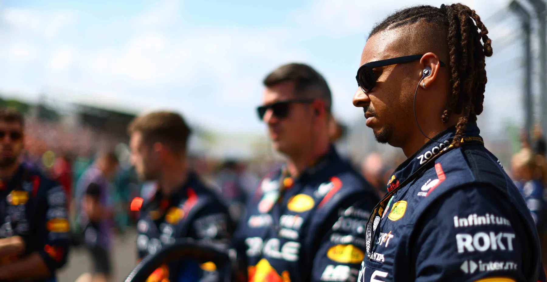 Red Bull mechanic looks out for Lewis Hamilton at Ferrari