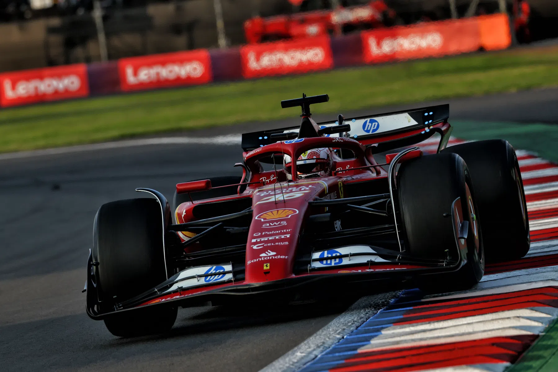 Ferrari F1 mechanic trips over in the pit lane during FP3 in Mexico