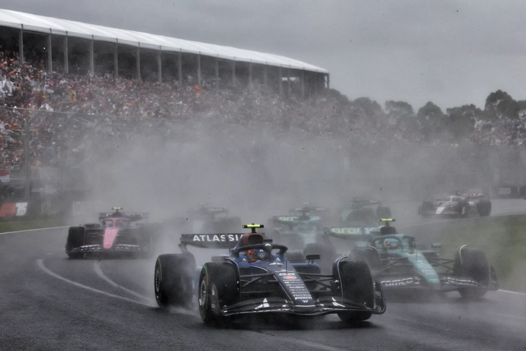 carlos sainx and jack doohan crash out of the f1 australian grand prix